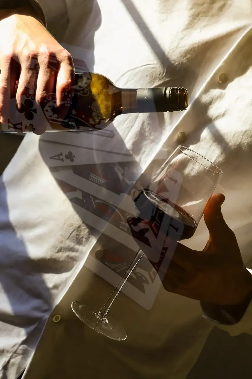 A double-exposure image of wine being poured